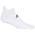 A white ankle sock is displayed upright the sock has a black logo on the side indicating a brand the background is plain and neutral in color.