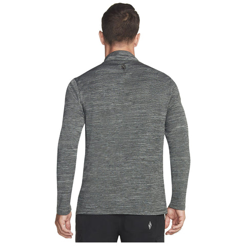 A person is wearing a long-sleeve, dark gray athletic shirt with a textured pattern and a small logo on the back while facing away from the viewer in a plain background.