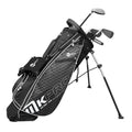 A black and grey golf bag stands upright on two legs holding several golf clubs with a zippered pocket on the side in a neutral background.