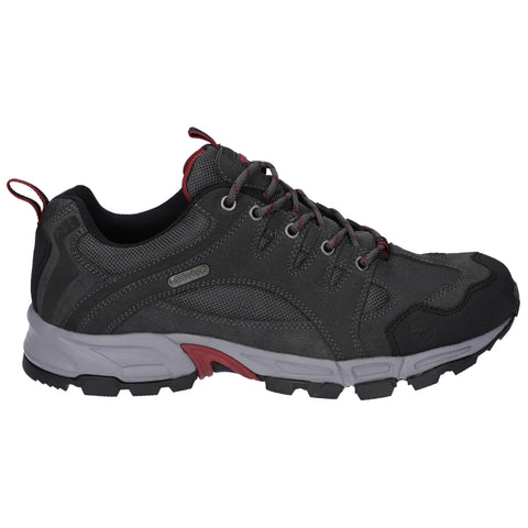 A black and gray athletic shoe sits on a flat surface featuring a mesh upper with red accents laces and a rugged sole designed for outdoor activities and comfort.