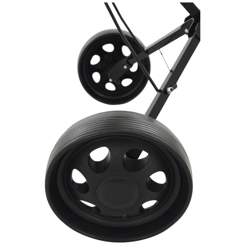 Black wheels are positioned at an angle on a wheeled frame with a sleek, matte finish showcasing circular cutouts and grooves in the rubber tire surface indicating movement potential.