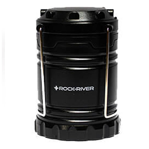 A black lantern stands upright featuring a metallic handle for carrying it The object is designed for providing light in dark environments such as camping or emergency situations