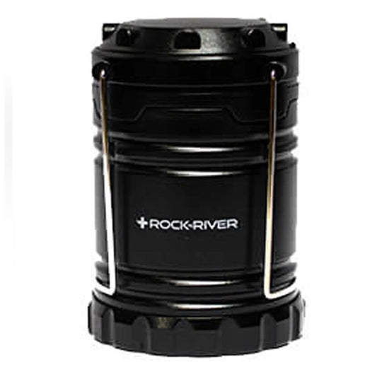 A black lantern stands upright featuring a metallic handle for carrying it The object is designed for providing light in dark environments such as camping or emergency situations