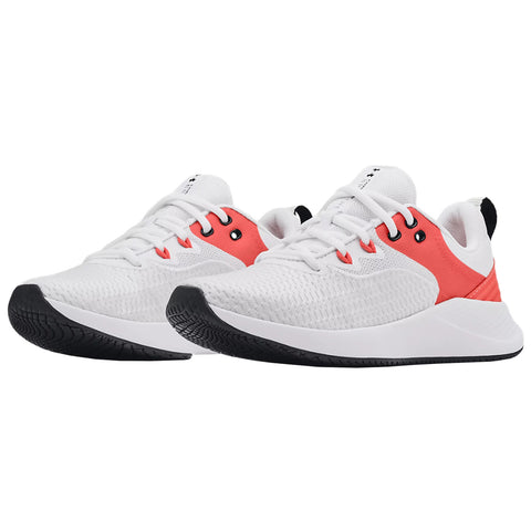 Two athletic shoes are positioned side by side displaying a predominantly white design accented with coral and black elements showcasing a sporty and modern aesthetic suitable for exercise or casual wear