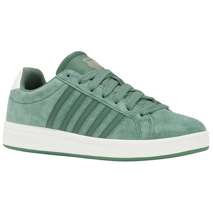 A green athletic shoe with a suede texture features three raised stripes along the side and a white rubber sole placed against a plain background.