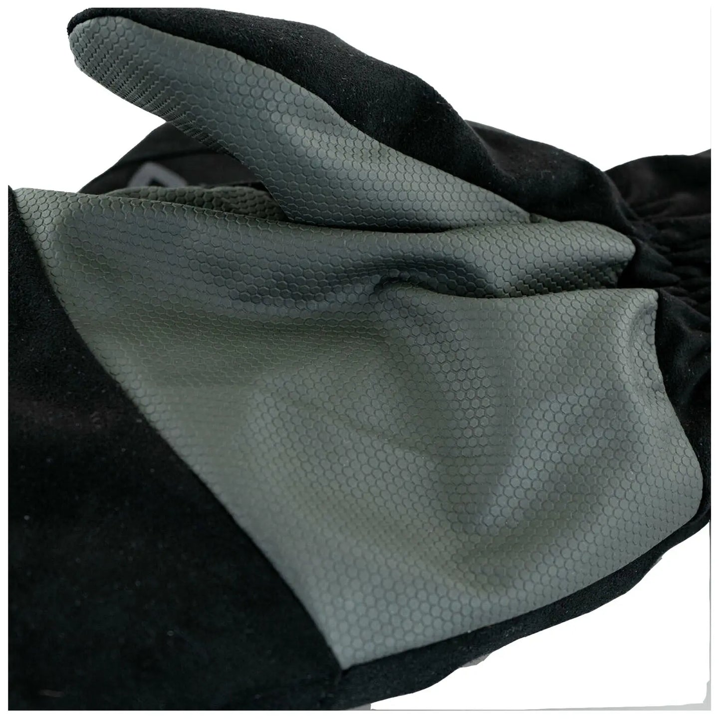 A black glove made of textured material is lying flat with a smooth gray section prominently displayed showcasing its design pattern amidst a neutral background.