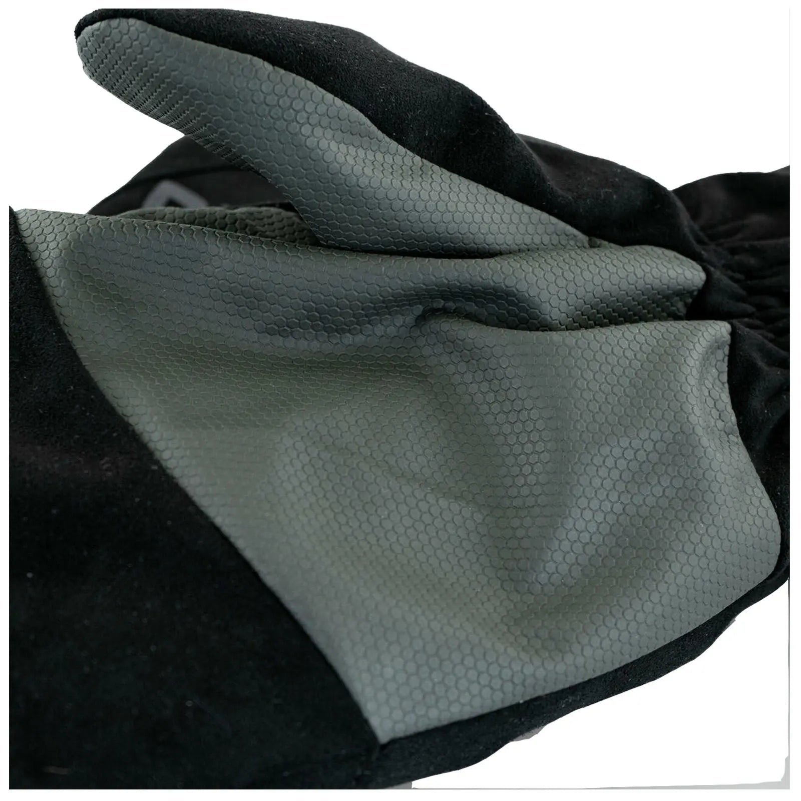 A black glove made of textured material is lying flat with a smooth gray section prominently displayed showcasing its design pattern amidst a neutral background.