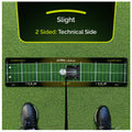 A golf training mat lies on green turf designed for practice with a black shoe positioned nearby on the mat displaying alignment guides and a central marker for putting technique. Text includes "Slight" "2 Sided: Technical Side" and website information