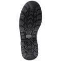 A black shoe sole lies flat showing detailed tread patterns designed for traction and stability in outdoor or rugged environments highlighting its functionality for various activities