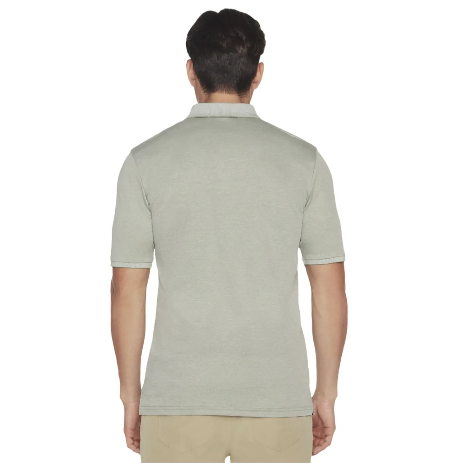 A man is wearing a short-sleeved light gray polo shirt facing away from the viewer in a simple background, emphasizing the shirt's design and fit.