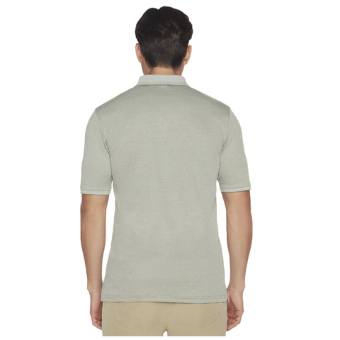 A man is wearing a short-sleeved light gray polo shirt facing away from the viewer in a simple background, emphasizing the shirt's design and fit.
