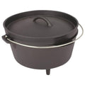 A black cast iron Dutch oven with a lid and a metal handle sits upright. Its sturdy design suggests it's suitable for cooking over an open flame or in an oven.
