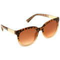 Sunglasses feature a tortoiseshell frame with gradient brown lenses resting on a flat surface showcasing a stylish design suitable for sunny outdoor contexts.