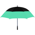 An umbrella with a black top section and a mint green lower section stands upright. It is designed to provide shade or protection from rain in outdoor settings.