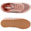 Light pink athletic shoe with mesh and suede materials features silver stripes on the side and a textured rubber sole displaying a zigzag pattern placed on a neutral background.