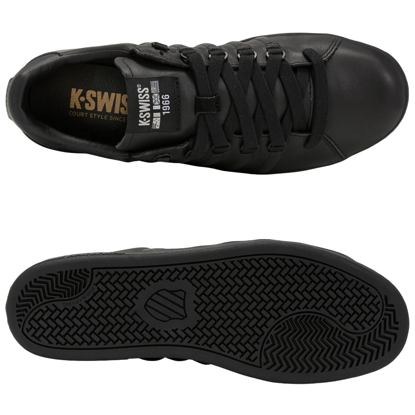 Black sneaker featuring a smooth leather upper and flat sole with a simple tread pattern positioned upside down showcasing the sole and right side up highlighting the laces and logo