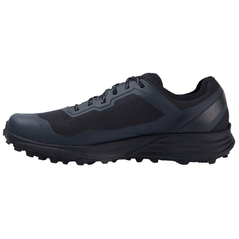 A dark athletic shoe designed for trail running features a textured upper for grip multiple laces for secure fastening and a rugged sole that enhances traction on uneven terrain.