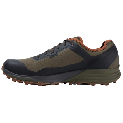 A durable running shoe features a combination of dark green and black materials with a rugged sole designed for traction on uneven terrain suitable for outdoor activities.