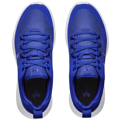 Blue athletic shoes are displayed from above with laces tied showcasing a mesh upper and a padded collar placed on a neutral background.