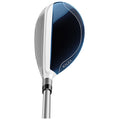 A golf club head with a sleek design features a glossy black striking surface and blue accents reflecting light while positioned upright against a neutral background.