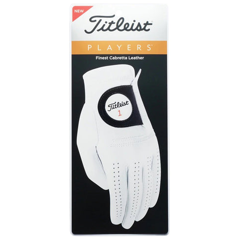 A golf glove is displayed on a packaging card featuring a white design with perforations and a black patch labeled Titleist 1 against a dark background with promotional text.