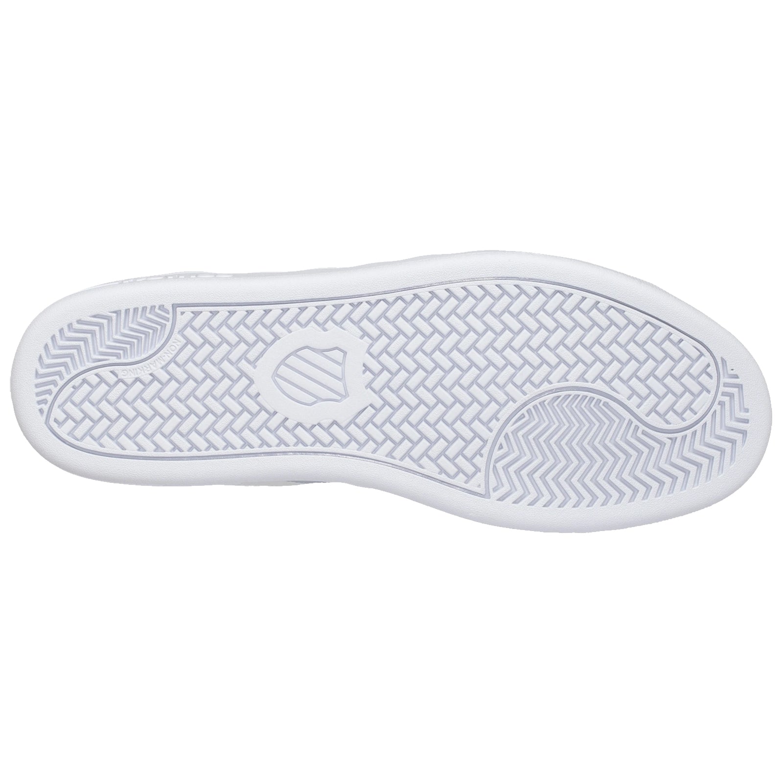 A white sneaker's sole features a textured pattern designed for traction the clean underside is shown against a plain background emphasizing its sleek design and functionality