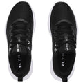 Black athletic shoes are displayed. They feature a textured mesh upper and white soles. The shoes are laid out side by side against a plain background, emphasizing their design and color.