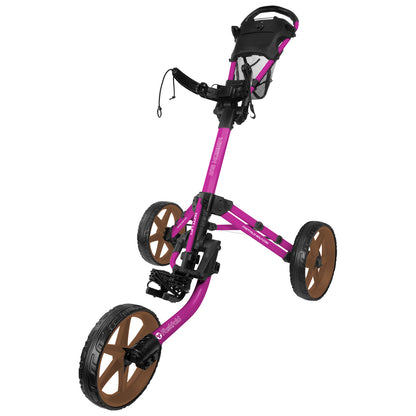 A pink golf pushcart with three wheels is positioned upright. The front wheels are brown. It features a mesh storage area and handles for easy maneuvering on a golf course.
