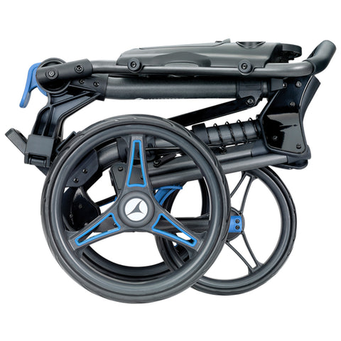 A black folding wheelchair with blue accents rests in a compact position showcasing its wheels and frame designed for easy transportation and storage in various environments.