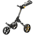 A golf push cart stands upright with three wheels and a handlebar for pushing. It is designed for transporting golf clubs and accessories across a course, showcasing a modern ergonomic design.