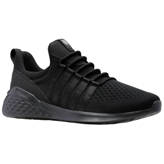 Black athletic shoes are positioned at an angle showcasing a textured mesh upper and a rubber sole while being presented against a clean, neutral background.