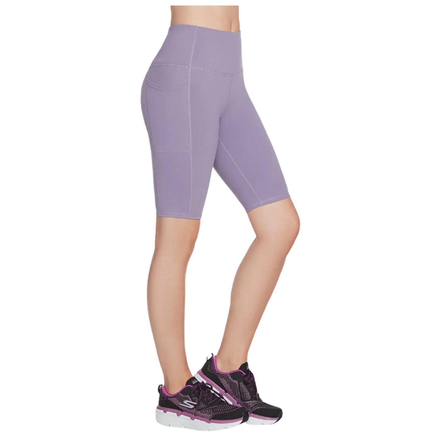 A pair of fitted purple bike shorts is displayed alongside black athletic shoes featuring purple accents the context suggests activewear suitable for exercise or casual use.