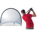 A golfer in a red shirt is swinging a club towards a large collapsible practice net designed to catch golf balls, set against a plain white background.