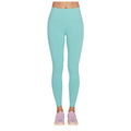 A pair of mint green leggings is displayed with a high waistband and a smooth finish alongside light pink athletic shoes creating a sporty appearance without a visible background.