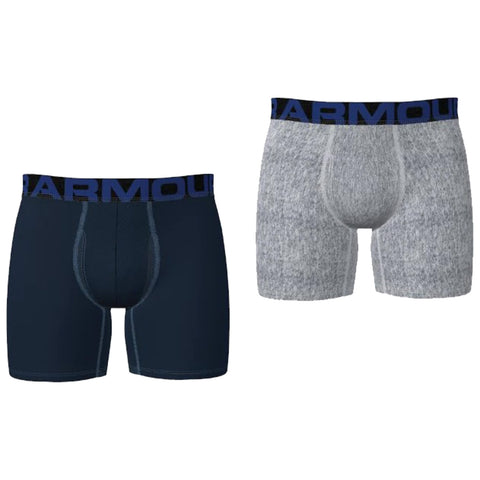 Two pairs of men's underwear are displayed side by side. The left is dark blue with a black waistband labeled ARMOUR. The right is light gray with a similar waistband.