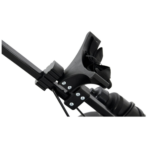 A black plastic device with adjustable straps is attached to a metal frame It appears to be a mounting bracket possibly for securing equipment in place in a mechanical setup
