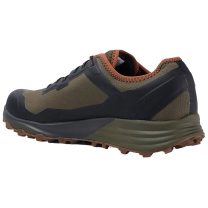 A hiking shoe is positioned at an angle showcasing its sturdy design and grip pattern the shoe features a mix of dark olive green and black materials with a brown accent on the collar.