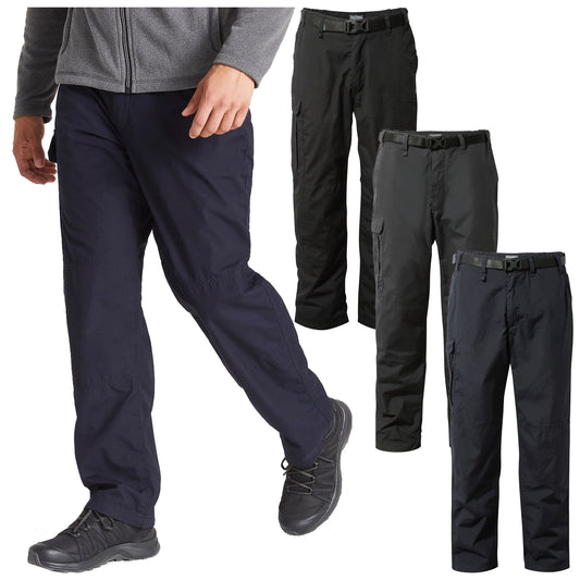 A man is walking in dark blue pants paired with black shoes while three different pairs of black pants are displayed beside him in a neutral background.
