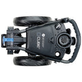 A compact electric golf trolley features two large rear wheels and a front wheel, with a control panel and handle for maneuvering. It is designed for transporting golf equipment on the course.