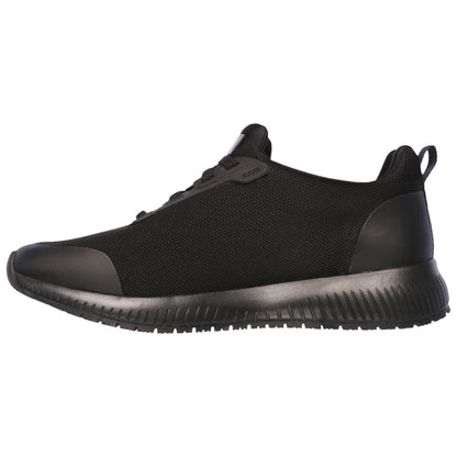 A black athletic shoe with a textured upper fabric and a rubber sole is presented facing to the left in a neutral setting, highlighting its sleek design and cushioning features.