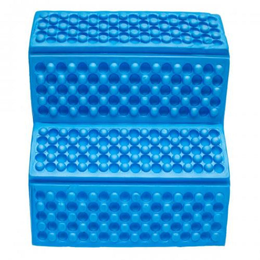 A blue rubber stepping cushion is positioned on a flat surface helping individuals elevate their feet while standing or exercising in a playful and engaging manner designed to provide comfort and stability.