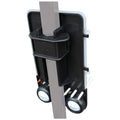 A black and gray golf accessory stores golf balls and tees with a vertical attachment for easy access on a pole near a golf course or practice area.