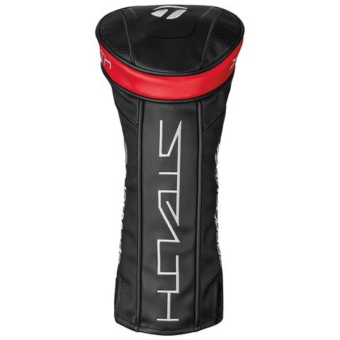 A black golf club headcover features a red top and white lettering. It is designed to protect the club head while not being used, typically placed on a golf course.
