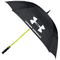 A large black umbrella with a bright yellow handle displays the logo UNDER ARMOUR while being held upright to provide shade or coverage in an outdoor setting.