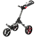 A golf push cart stands upright with three wheels including two larger rear wheels and one smaller front wheel features a silver and black frame with a handle for steering and storage compartment