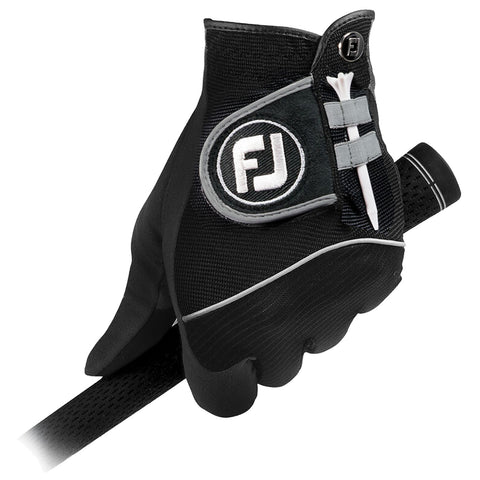 A black golf glove is gripping a golf club with a tee holder attached to its side while providing a secure grip for better swing control in a golfing context.