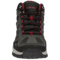 A hiking shoe features a sturdy gray exterior with red accents and mesh panels. It is positioned upright on a flat surface, designed for outdoor activity and stability.