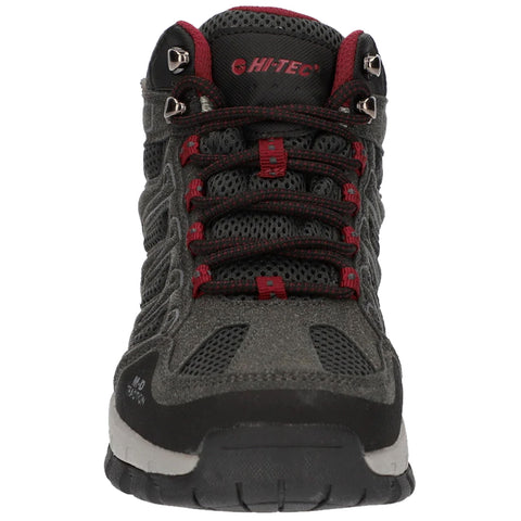 A hiking shoe features a sturdy gray exterior with red accents and mesh panels. It is positioned upright on a flat surface, designed for outdoor activity and stability.