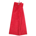 A red towel hangs from a metal ring suggesting it is ready for use in a bathroom or kitchen environment. The fabric appears soft and absorbent.