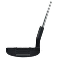 A black golf putter rests upright with a flat face and grooved surface reflecting its design purpose for accurate putting in a golf course setting